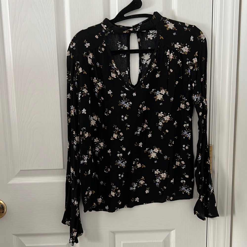 Black shirt with white and blue flower print